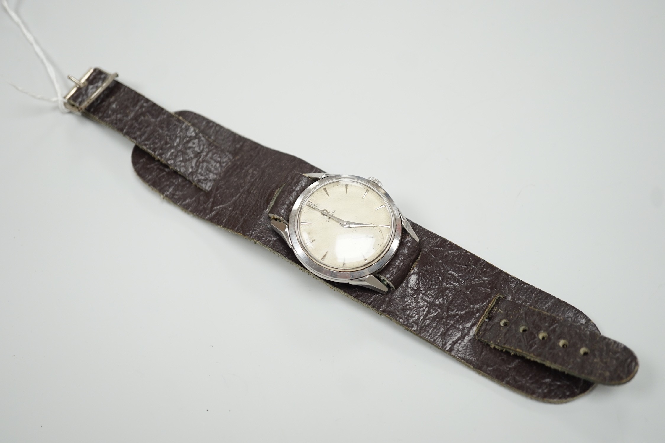A gentleman's early 1950's stainless steel Omega wrist watch, with baton numerals and subsidiary seconds, movement c.266, on associated leather strap, case diameter 36mm.